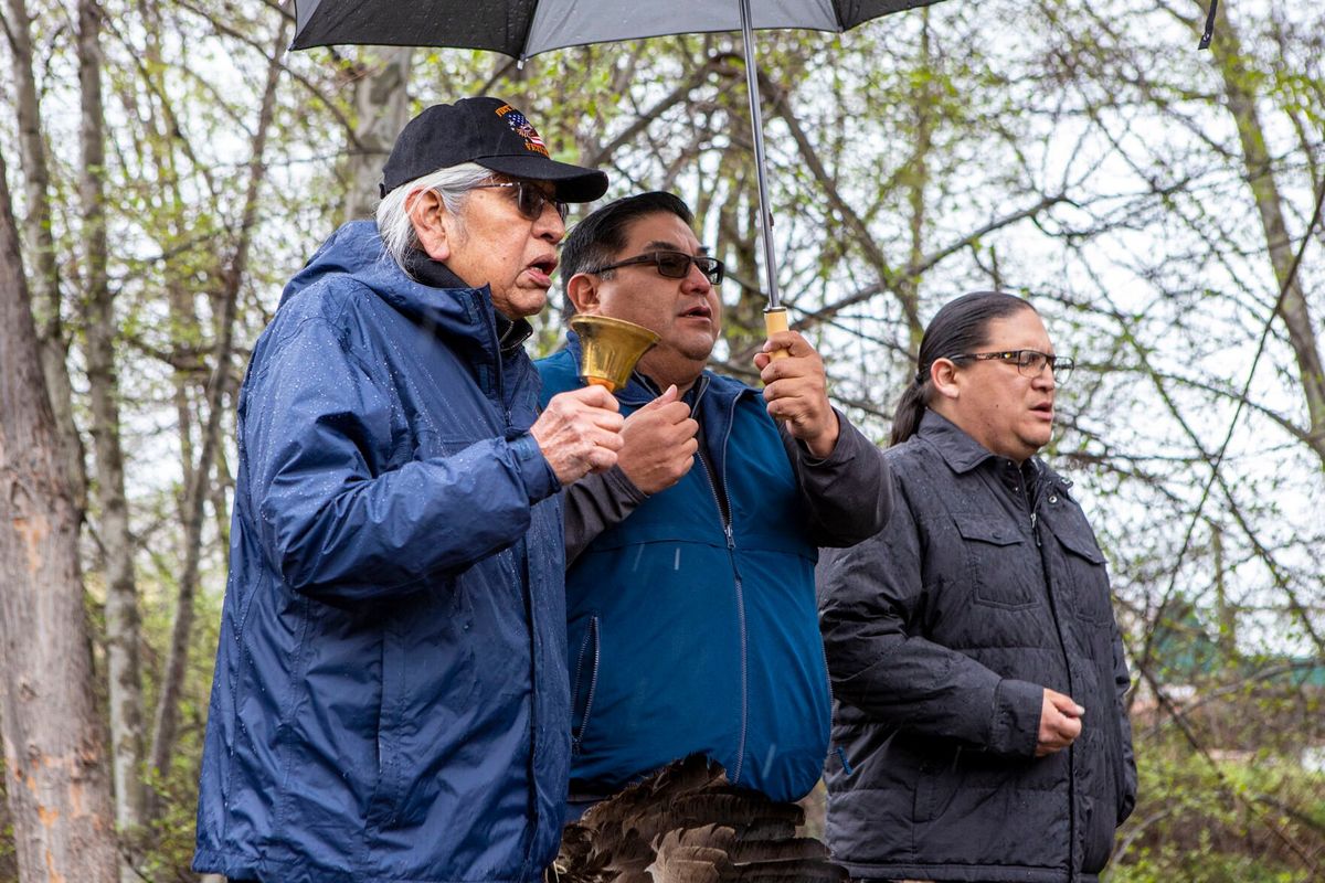 Elder and spiritual leader Chuck Axtell, left, sings Thursday alongside Nez Perce Tribal Executive Committee Vice-chairman Shannon Wheeler and treasurer Casey Mitchell during the opening ceremony of a Pacific lamprey release into Asotin Creek in Asotin.  (Austin Johnson/Lewiston Tribune)