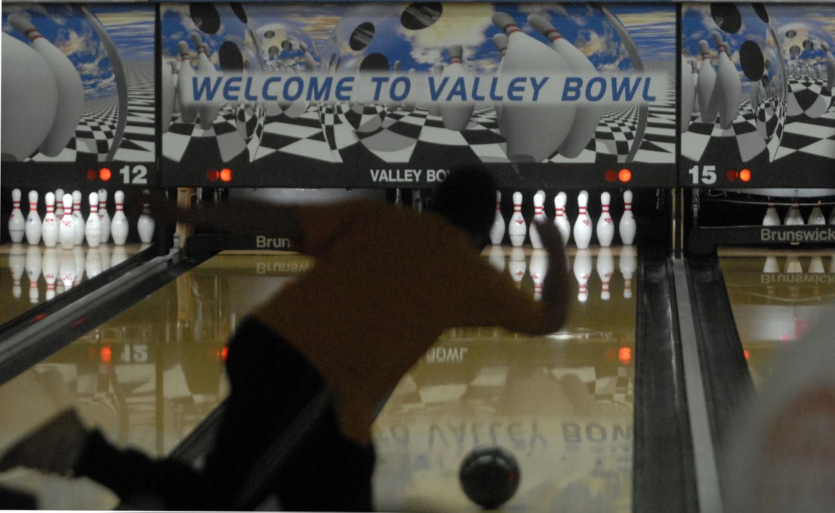 An early morning bowler throws a ball down the alley after finishing breakfast. Valley Bowl offers a $6.99 breakfast on Sunday mornings that includes three lines of bowling. (J. Rayniak / The Spokesman-Review)