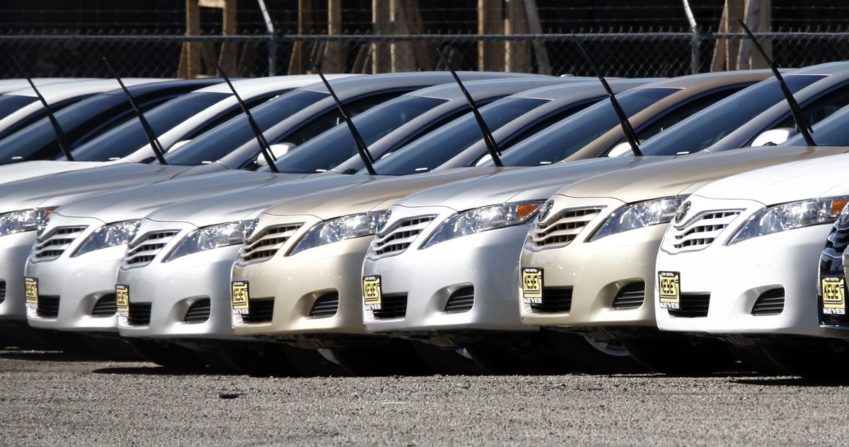 Toyota models that have been withdrawn for sale, identified by a single windshield wiper pointing skyward, are seen at a storage lot for Keyes Toyota in the Van Nuys area of Los Angeles on Thursday. (Associated Press)