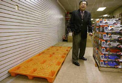 
Megatoys CEO Charlie Woo checks his toy warehouse's low inventory this week in Los Angeles. Woo is hoping to get inventory faster for the holidays, but it is currently backed up at the ports of entry. 
 (Associated Press / The Spokesman-Review)