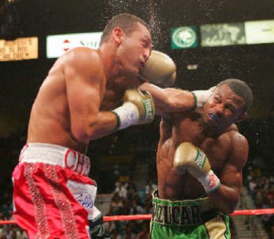 
Shane Mosley lands a right on Jose Luis Cruz during their welterweight bout in Las Vegas. 
 (Associated Press / The Spokesman-Review)