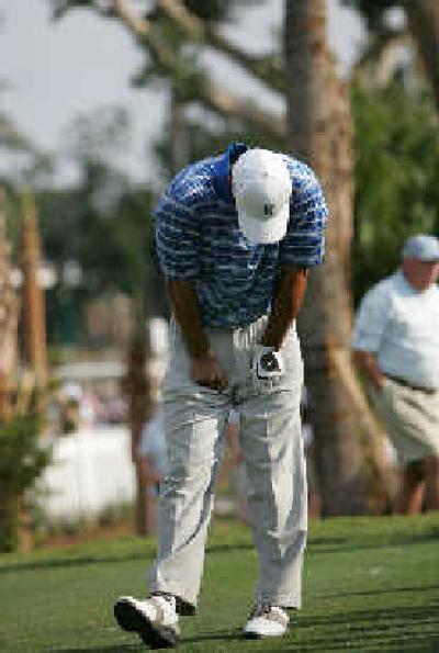 
Tiger Woods reacts to a tee shot on a day when he didn't hit many fairways. 
 (Associated Press / The Spokesman-Review)
