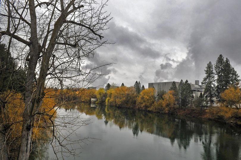 The Spokane River flows quietly past the Inland Empire Paper plant in Millwood Monday April 5, 2010. (Christopher Anderson / The Spokesman-Review)