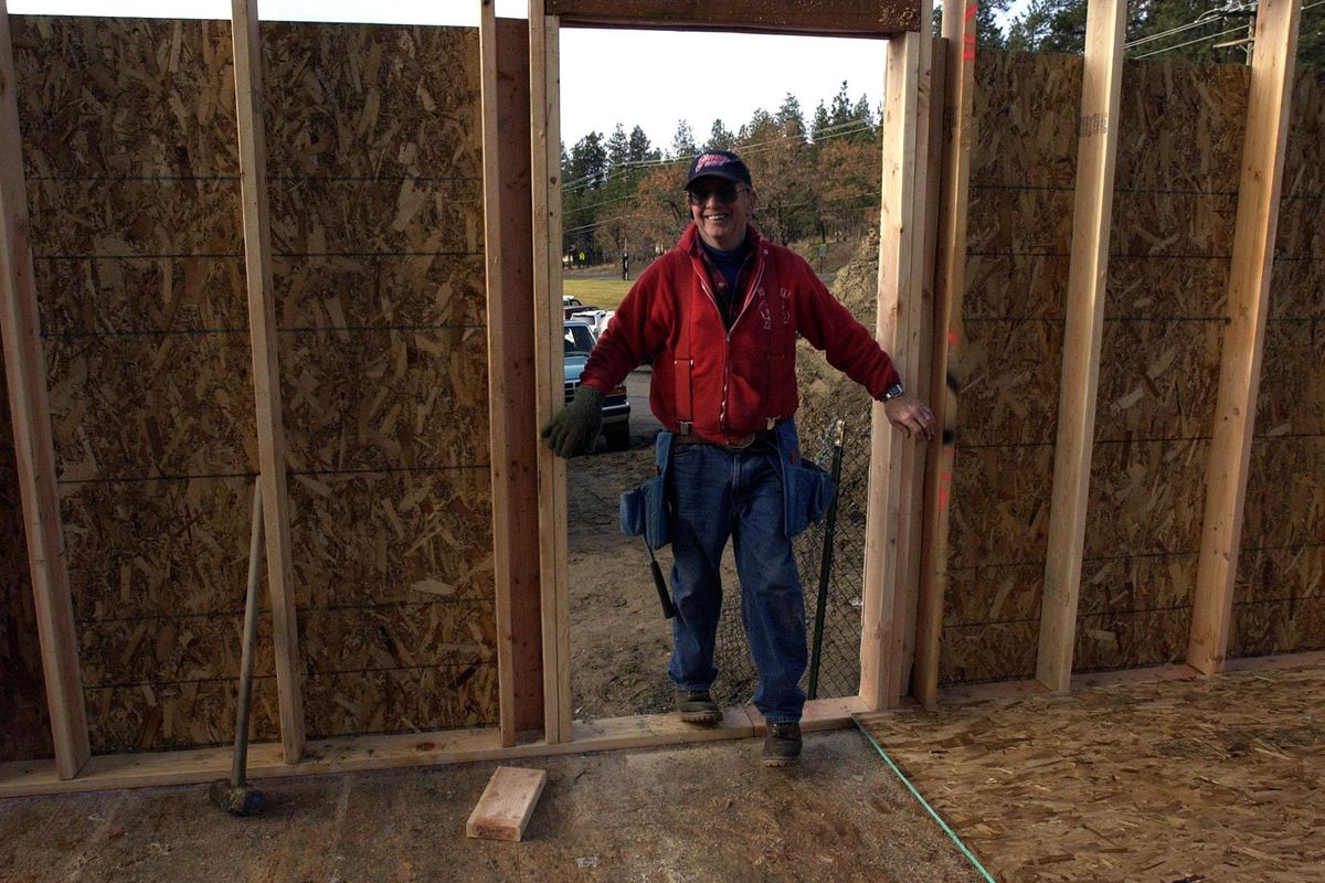 Vern Ziegler checks on his volunteer crew at a new building on the campus of the Outdoor Learning Center. (Steve  Thompson / The Spokesman-Review)