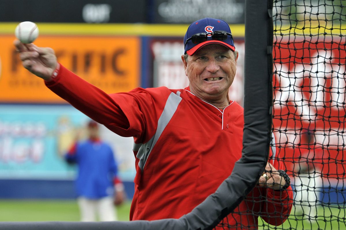Spokane Indians manager, Tim Hulett fires batting practice to his new players during practice on Wednesday. (Dan Pelle)