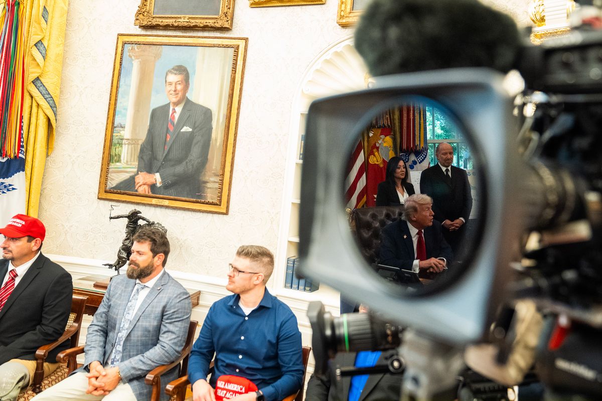 Veterans listen as President Donald Trump answers questions in the Oval Office of the White House on April 23. MUST CREDIT: Demetrius Freeman/The Washington Post (Demetrius Freeman/The Washington Post)
