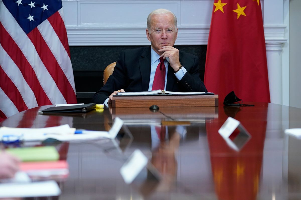 FILE - President Joe Biden listens as he meets virtually with Chinese President Xi Jinping from the Roosevelt Room of the White House in Washington, Nov. 15, 2021. The Biden administration has invited Taiwan to its upcoming Summit for Democracy, prompting sharp criticism from China, which considers the self-ruled island as its territory. The invitation list features 110 countries, including Taiwan, but does not include China or Russia.  (Susan Walsh)