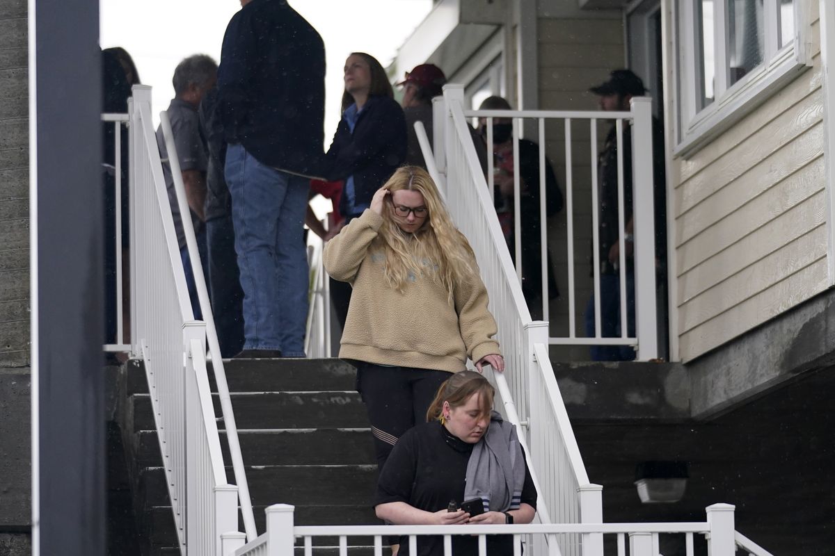 People leave a briefing for family members by Coast Guard and NTSB officials in Port Fouchon, La., Friday, April 16, 2021, after a lift boat capsized in the Gulf of Mexico during a storm on Tuesday.  (Gerald Herbert)