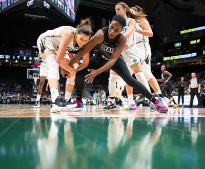 Seattle Storm's Jantel Lavender, right, tries to get the ball from New York Liberty's Rebecca Allen during the first half of a WNBA basketball game Friday, May 27, 2022, in Seattle.  (Associated Press)