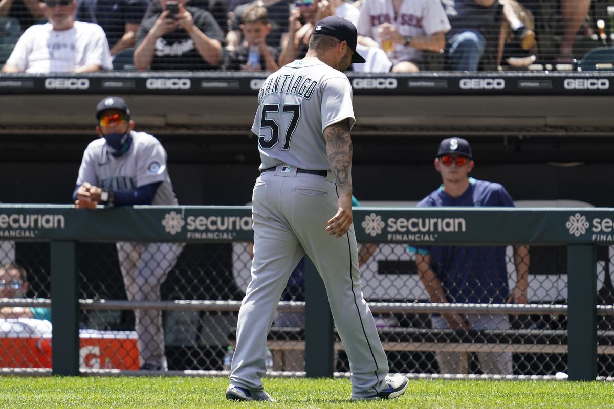 Seattle Mariners relief pitcher Hector Santiago walks to the dugout after he was ejected by home plate umpire Phil Cuzzi during the fifth inning in the first baseball game of a doubleheader against the Chicago White Sox in Chicago, Sunday, June 27, 2021.  (Nam Y. Huh)