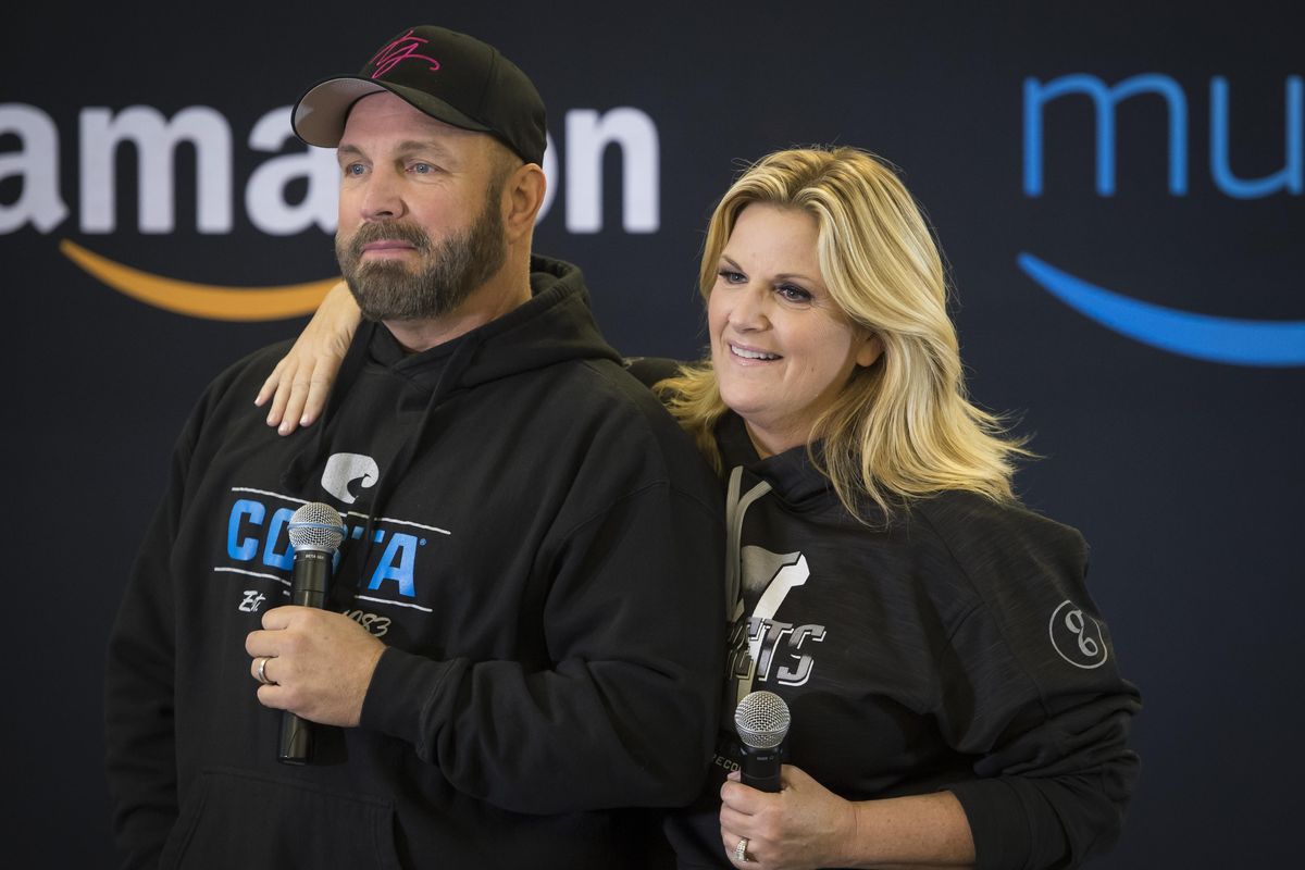 Garth Brooks and his wife Trisha Yearwood speak to media gathered at the Spokane Arena, Friday, Nov. 10, 2017. (Colin Mulvany / The Spokesman-Review)