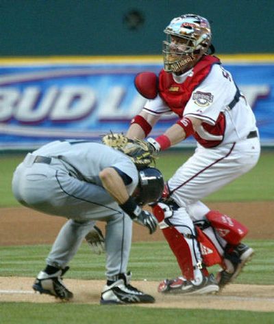 
 Ichiro Suzuki of the Seattle Mariners gets tagged out in a rundown by  Washington Nationals catcher Brian Schneider in the fourth inning Friday. 
 (Associated Press / The Spokesman-Review)