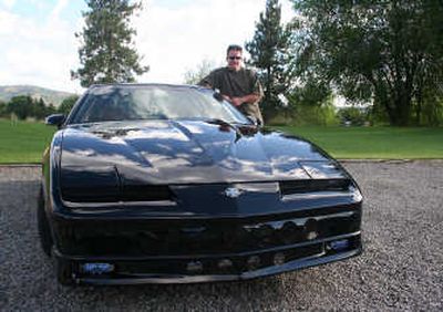 
Marty Stromberger is shown with his 1988 Firebird. The one-time street car sports a 900-horsepower motor that tackles the quarter-mile in 9.7 seconds at more than 140 miles per hour.
 (Paul Delaney / The Spokesman-Review)