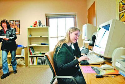 
Lewis and Clark High School student Amanda Hughes works on an online Advanced Placement English assignment recently.  
 (Jed Conklin / The Spokesman-Review)