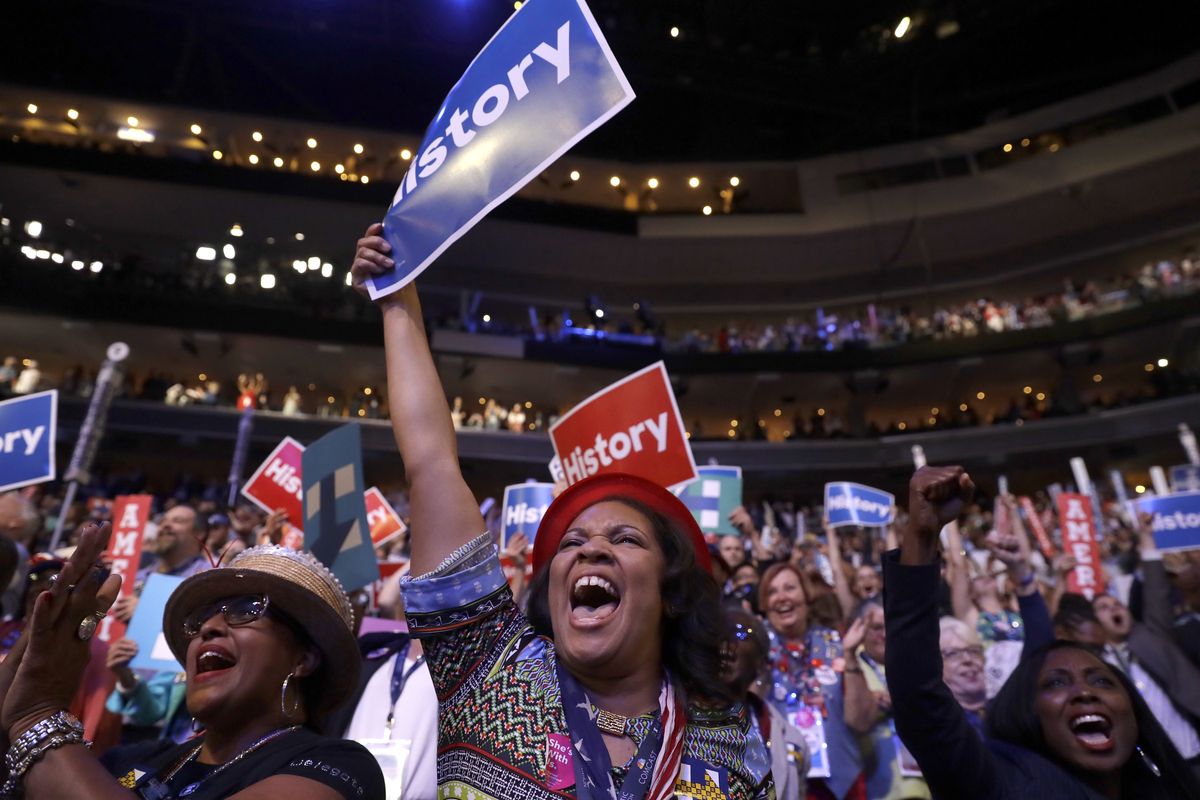 FILE - In this July 26, 2016, file photo, delegates cheer as Democratic Presidential candidate Hillary Clinton appears on the screen during the second day session of the Democratic National Convention in Philadelphia. Democratic presidential candidate former Vice Presiden JoBiden’s presidential nominating convention will highlight the U.S. political spectrum from the left flank of New York Rep. Alexandria Ocasio-Cortez to the Republican old guard of former Ohio Gov. John Kasich. But that doesn’t mean there’s room for every prominent Democrat who would get a share of the spotlight at a routine convention taking place without the backdrop of a pandemic.  (Matt Rourke)