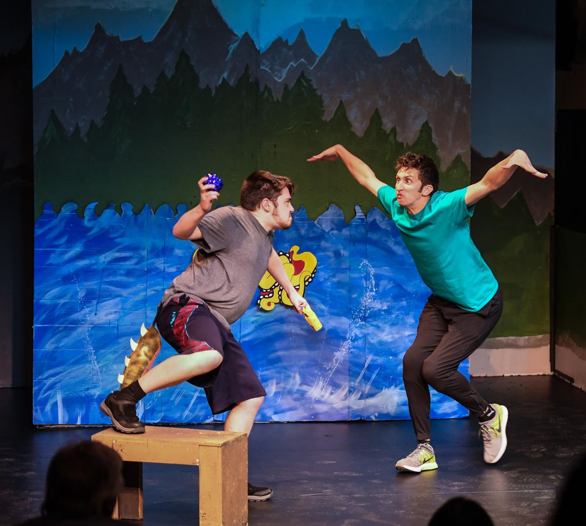 Dane Larson, as  dinosaur, right, and Jordan Baird, as the dragon, perform Landon Gamache’s “The Dinosaur and the Dragon” on opening night Thursday, May 10, 2018, during the Kids Corner Playwright Festival at  Stage Left Theater. (Dan Pelle / DAN PELLE/The Spokesman-Review)