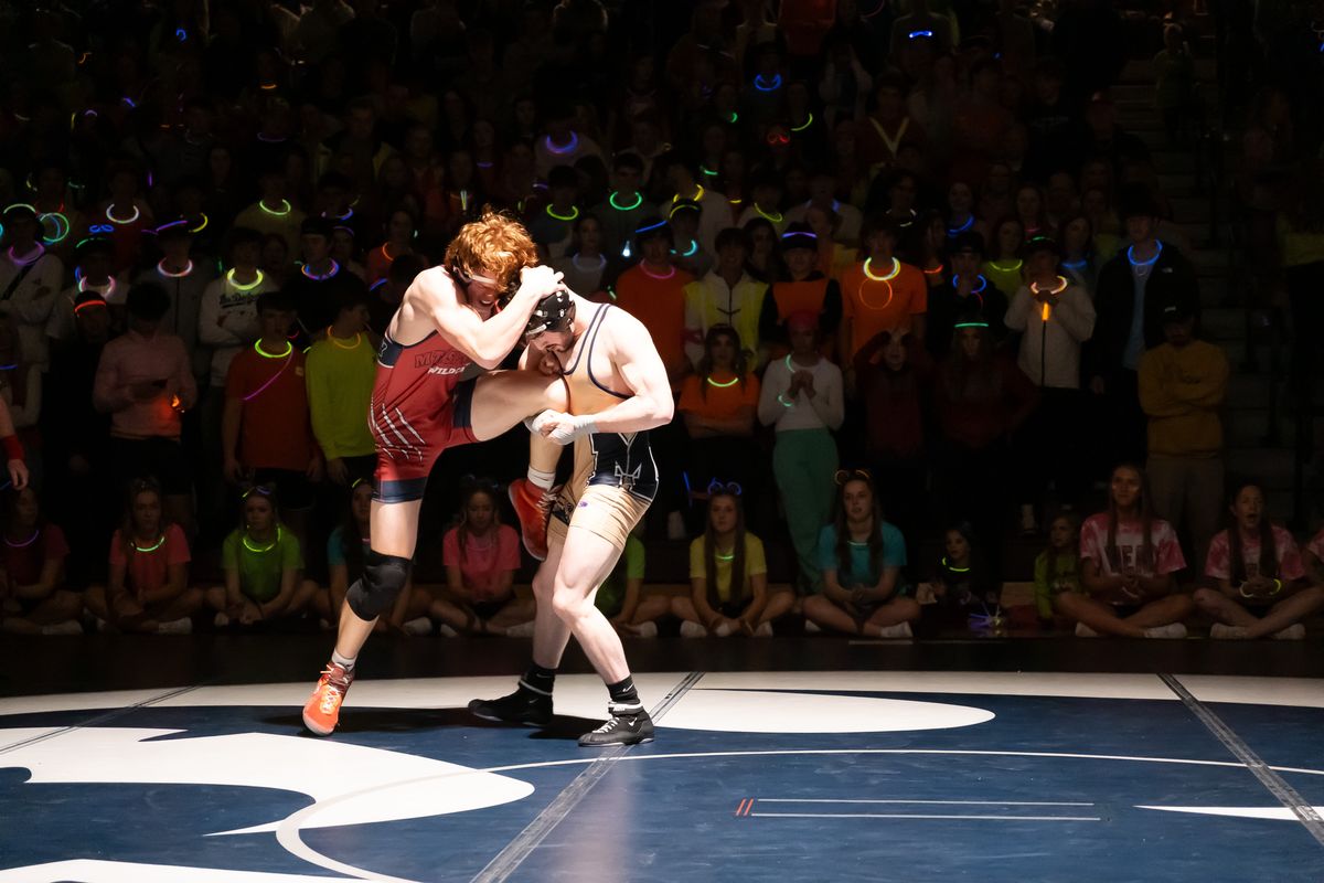 Mead senior Jeroen Smith, right, takes down Mt. Spokane’s Gabe Singley during a Greater Spokane League dual on Thursday, Jan. 25, 2024, at Mt. Spokane High School in Spokane, Wash. (Madison McCord/For The Spokesman-Review)