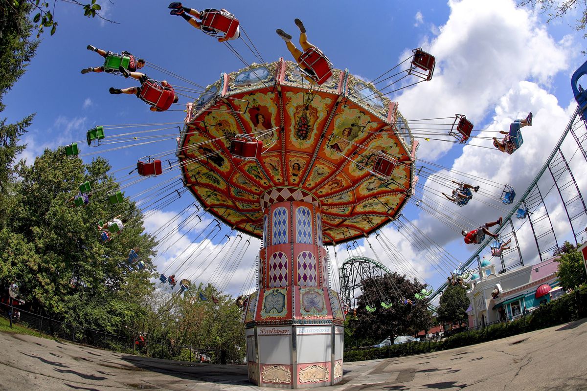 Visitors ride the Wave Swinger in the “Lost Kennywood” section of Kennywood Park in West Mifflin, Pa. (Keith Srakocic)