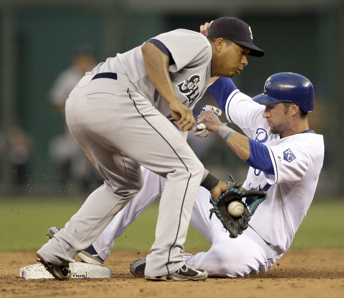 Royals’ Ross Gload steals second as second baseman Jose Lopez fields throw in the fifth inning when the Royals scored all their runs. (Associated Press / The Spokesman-Review)