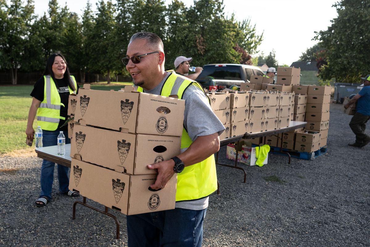 Evaristo Salas, 45, was only 16 when he was wrongfully convicted of shooting 24-year-old Jose Arreola twice in the head in November 1995. He spent 26 years in prison before finally being released two years ago Sunday. He’s returned to his Sunnyside, Washington, community, dedicating his time to helping others, like nonprofit United With You distribute free boxes of fruits and vegetables to the needy. (COLIN MULVANY /THE SPOKESMAN-REVIEW)