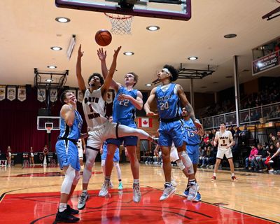 North Idaho point guard Nate Pryor (1) competes for a rebound with Community Colleges of Spokane guard Garrett White (22) during a college basketball game, Wed. Feb. 20, 2019, at NIC. (Colin Mulvany / The Spokesman-Review)