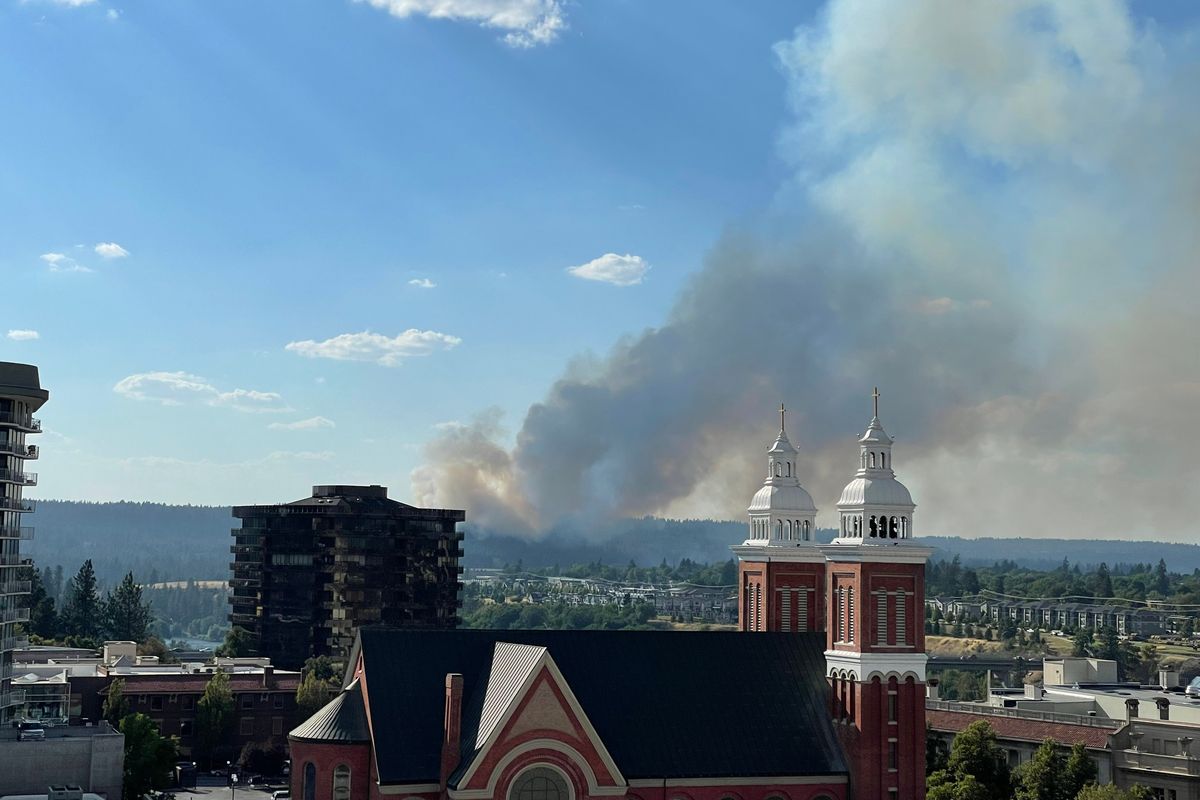 Smoke from a wildfire that started Friday afternoon can be seen from downtown Spokane. (The Spokesman-Review)