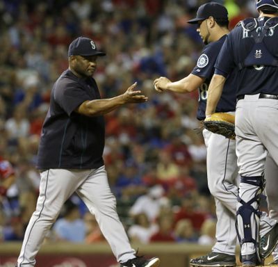 M’s manager Lloyd McClendon, left, yanked starting pitcher Vidal Nuno in the fourth inning. (Associated Press)
