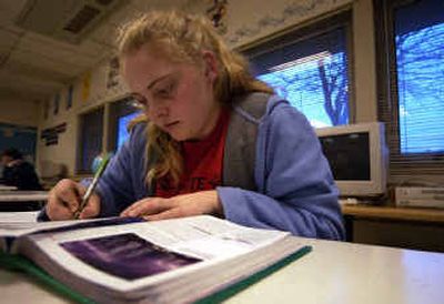 
Lauren Puhek, 13, works on her science homework after school at North Pines Middle School. Puhek 