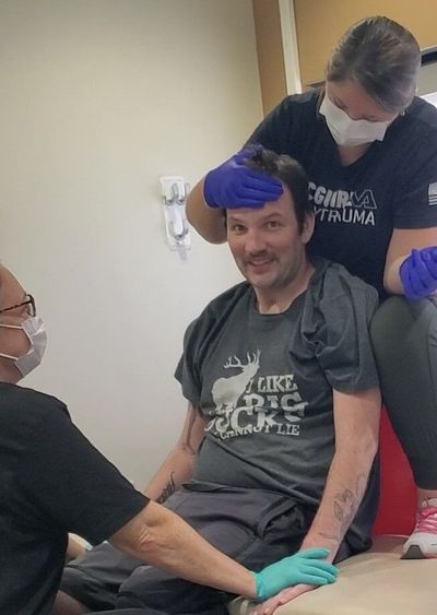 Nathanael Beier smiles while undergoing physical therapy. Beier was shot in the head during an April drive-by shooting outside Lucky’s Irish Pub in downtown Spokane. Two women were also injured in the shooting.  (Courtesy of Kym Beier)