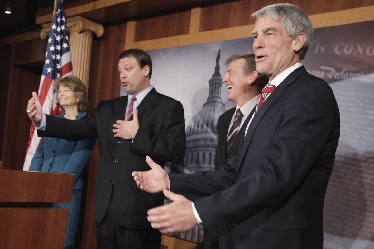 From left, Sen. Lisa Murkowski, R-Alaska, Rep. Heath Shuler, D-N.C., Rep. Paul Gosar, R-Ariz, and Sen. Mark Udall, D-Colo., take part in a news conference on Capitol Hill in Washington, Tuesday, Jan. 25, 2011, to discuss Democrats and Republicans sitting together during President Barack Obama