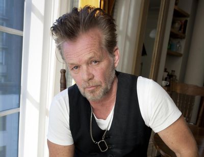 Singer-songwriter John Mellencamp poses for a portrait to promote his album “Plain Spoken” on Sept. 22, 2014, at the Greenwich Hotel in New York. Just days before the Super Bowl, John Mellencamp sunk to his knees in support for the Black Lives Matter movement after performing a political ballad on the “Late Show With Stephen Colbert.” (Amy Sussman / Amy Sussman/Invision/AP)