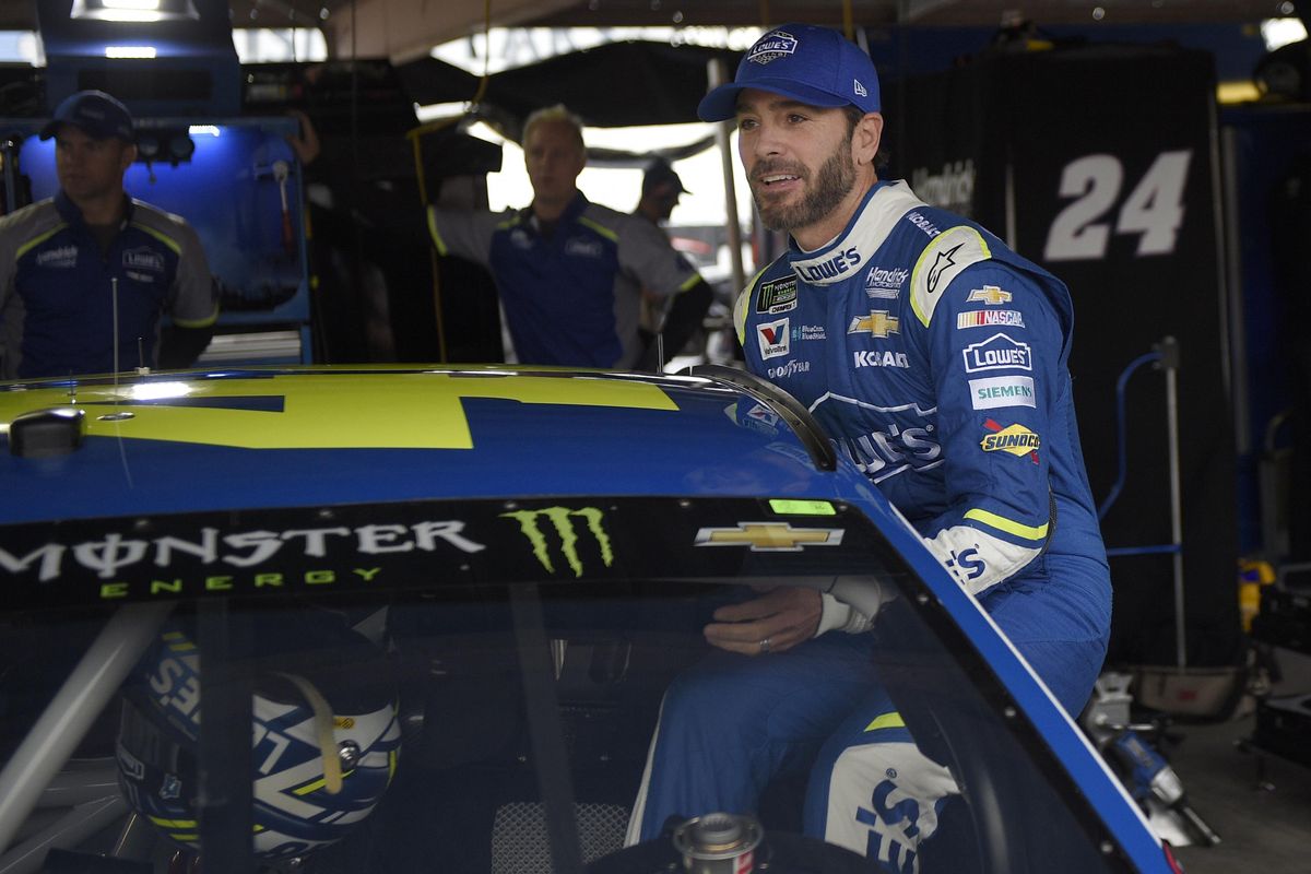 Jimmie Johnson climbs into his car before practice for the NASCAR Cup series auto race, Saturday, June 3, 2017, at Dover International Speedway in Dover, Del. (Nick Wass / Associated Press)