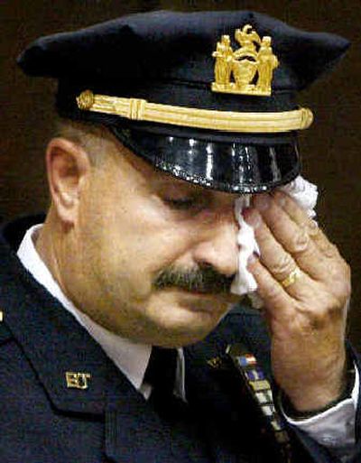 
Port Authority police Lt. John McLoughlin wipes his eyes during an emotional final roll call in New York on Wednesday. 
 (Associated Press / The Spokesman-Review)