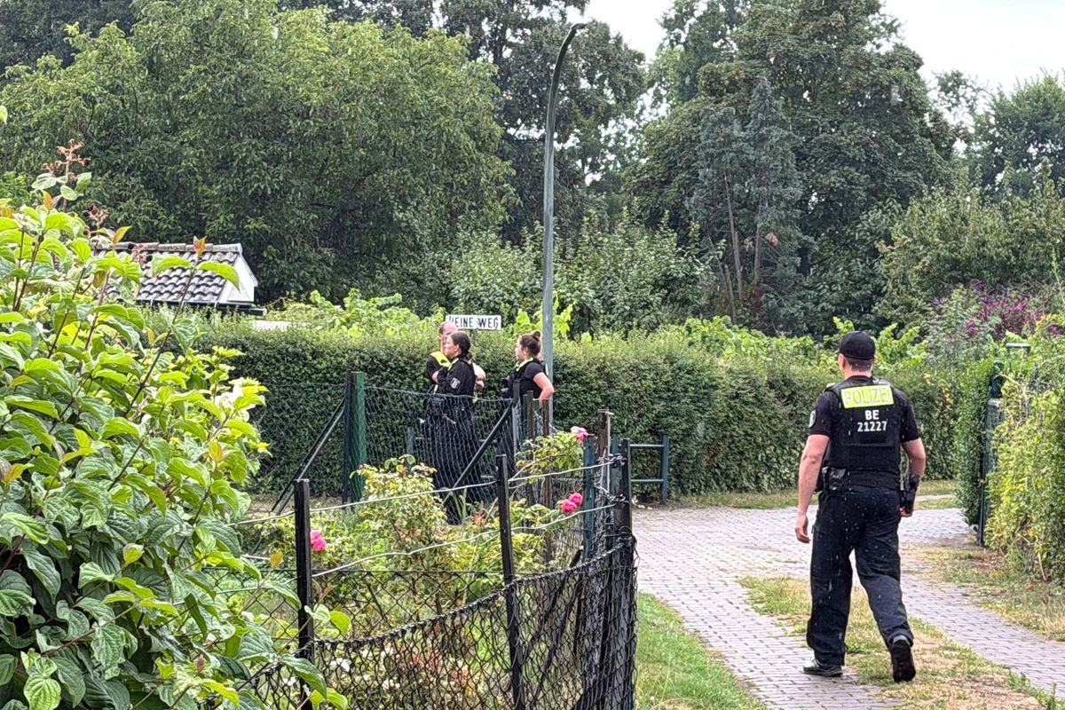 Police officers stand on the scene at an allotment garden community in Berlin-Spandau. According to information from security sources, one person was killed during a police operation in Spandau following the terrorist attack on the sidelines of Christopher Street Day (CSD). (Tribune News Service )