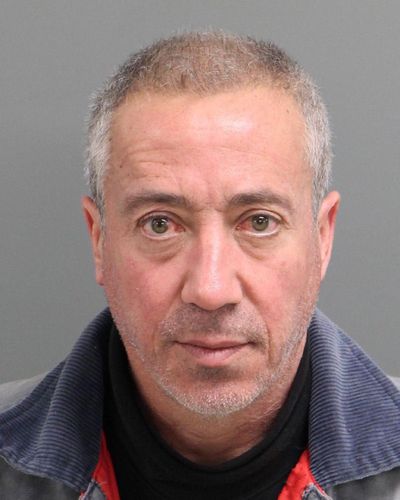 This undated mug shot shows Christian Desgroux, 57, who’s accused of pretending to be a U.S. Army general when he landed a chartered helicopter at a technology company in North Carolina in November. (Associated Press)