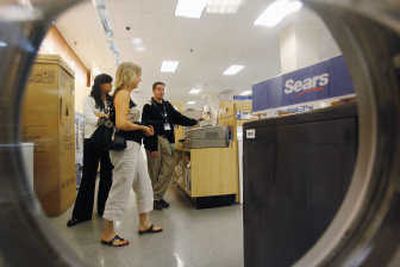 
Customers check out appliances at a Sears store in Niles, Ill., on Wednesday. Increasingly, investors regard Sears as a hedge fund masquerading as a retailer.  Associated Press
 (Associated Press / The Spokesman-Review)