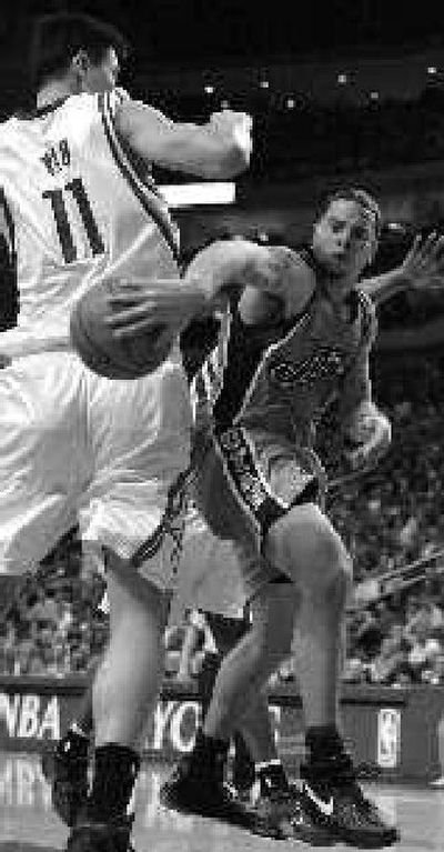 
Utah Jazz guard Deron Williams passes the ball around Houston's Yao Ming. 
 (Associated Press / The Spokesman-Review)