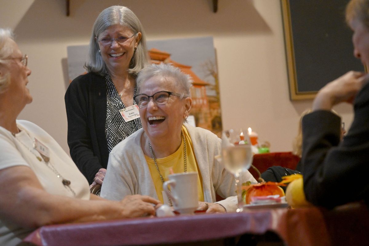 Spokane Compass Club members, from left, Deb Mallion, Kathy Cousineau and Carol Hannah share a laugh during a meeting at Das Stein Haus in Spokane earlier this month. The club welcomes newcomers to the area who are in transition, such as recently retired and any woman wanting to make new friends.  (Kathy Plonka/The Spokesman-Review)