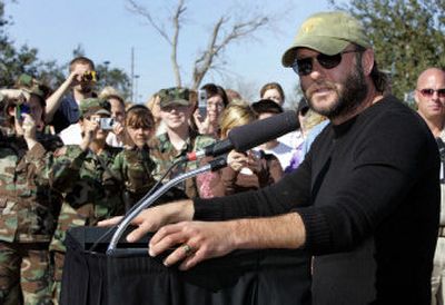 
Singer Tim McGraw, right, speaks during a news conference in Chalmette, La., Tuesday. McGraw helped announce a partnership with Amazon.com and a group of celebrities to raise funds for victims of Hurricanes Katrina and Rita. 
 (Associated Press / The Spokesman-Review)