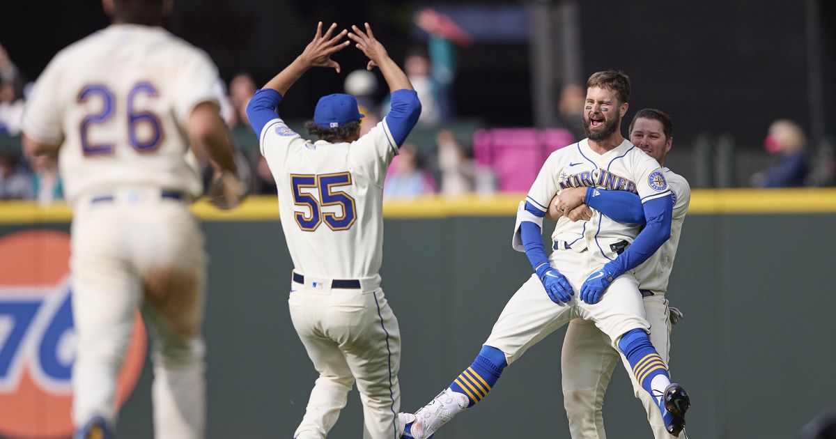 Milwaukee Brewers' Jesse Winker catches a fly ball hit by Chicago White Sox  Gavin Sheets during the first inning of a spring training baseball game,  Tuesday, March 21, 2023, in Phoenix. (AP