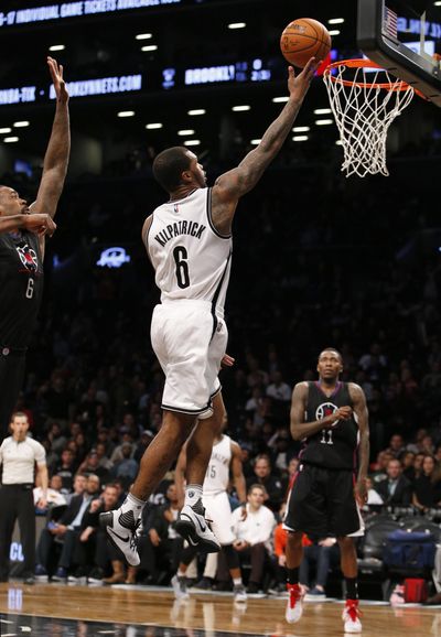 Brooklyn Nets guard Sean Kilpatrick, center, goes up for a basket in overtime of an NBA basketball game Tuesday, Nov. 29, 2016, in New York. (Kathy Willens / Associated Press)