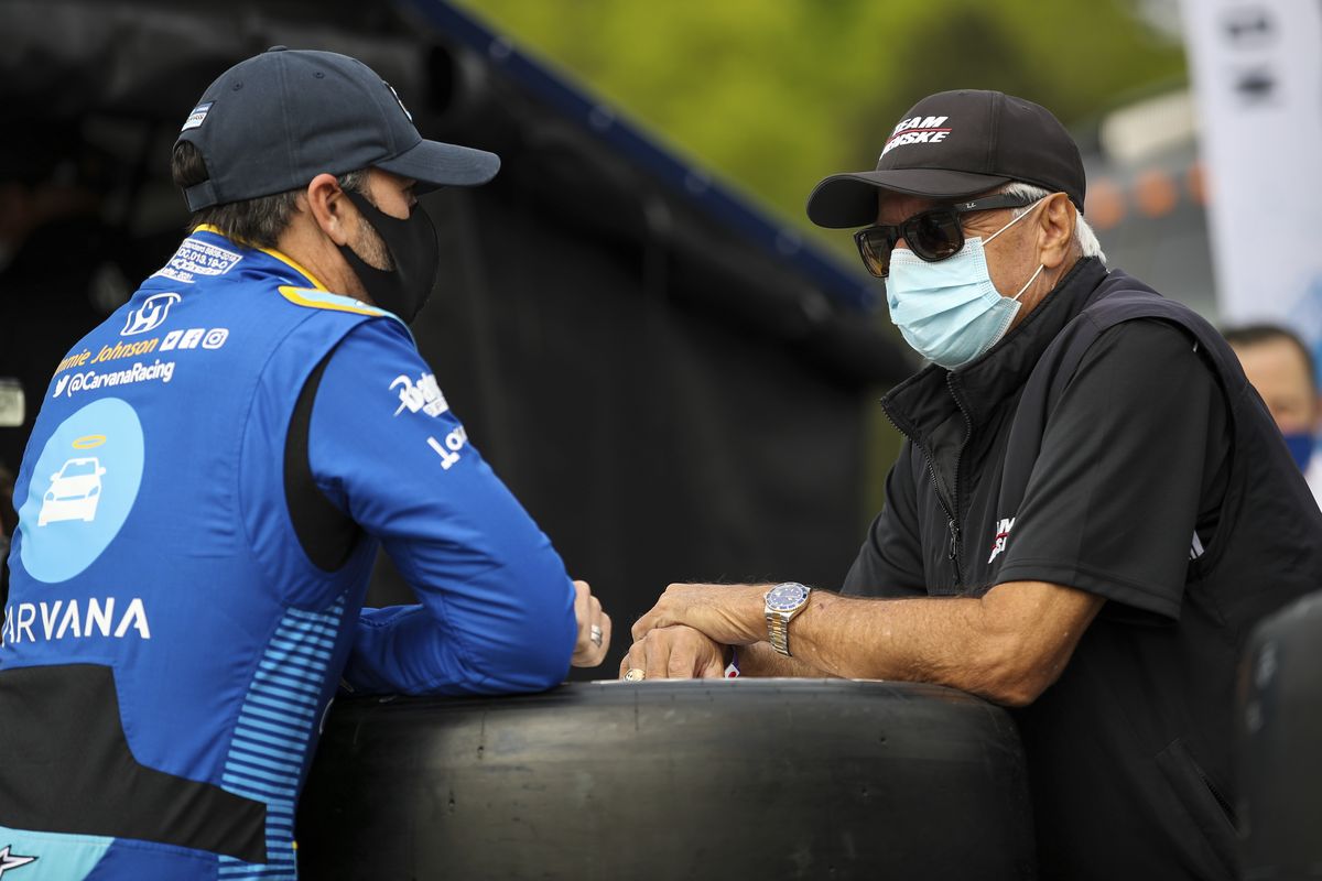 In this image provided by IndyCar, seven-time NASCAR champion Jimmie Johnson, left, speaks to four-time Indianapolis 500 winner Rick Mears before the first IndyCar practice session of the season, Saturday, April 17, 2021 at Barber Motorsports Park in Birmingham, Ala. Johnson will be an IndyCar rookie this season and make his series debut in Sunday’s opener. Mears was his childhood hero.  (Associated Press)