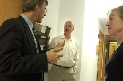 
 Bill Foxcroft, IPCA's executive director, left, Joel Hughes, CEO of the clinic, and Dr. Leanne Rousseau, medical director, talk in the hallway of the clinic. 
 (The Spokesman-Review)