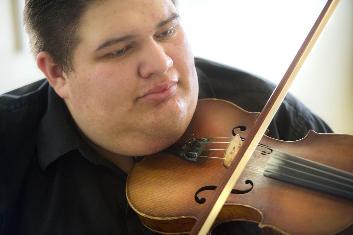 Aaron Castilla is a 21-year-old fiddling and mandolin bluegrass sensation who lives in Spokane Valley. (Dan Pelle / The Spokesman-Review)