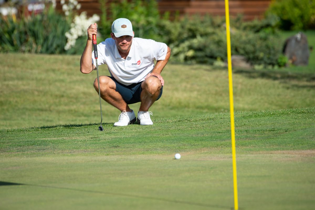Vinnie Murphy eyes his upcoming putt during the final round of the Lilac Invitational golf tournament at The Fairways Golf Course on Sunday Aug. 2, 2020. Jamie Hall eventually won the tournament.  (Libby Kamrowski/ THE SPOKESMAN-REVIEW)