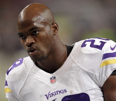 FILE - In this Sept. 7, 2014, file photo, Minnesota Vikings running back Adrian Peterson warms up for an NFL football game against the St. Louis Rams in St. Louis. The Vikings benched Peterson for Sunday's game after his attorney said he had been indicted by a Texas grand jury on a charge of child abuse. Attorney Rusty Hardin says the charge accuses Peterson of using a branch, or switch, to spank his son. He says Peterson has cooperated with authorities and