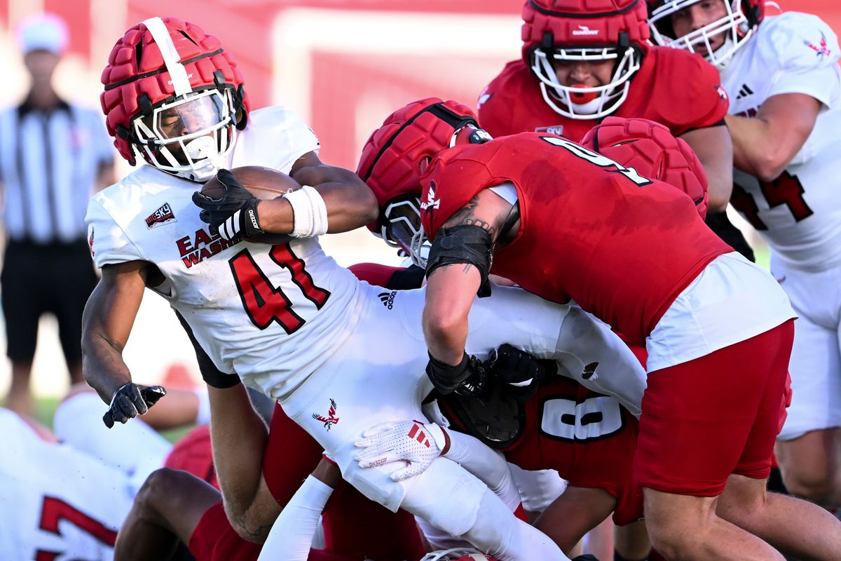 EWU linebacker Myles Mayovsky makes the hit on running back Kevin Allen III during an Aug. 14 scrimmage at ONE Spokane Stadium. (Tyler Tjomsland/The Spokesman-Review)