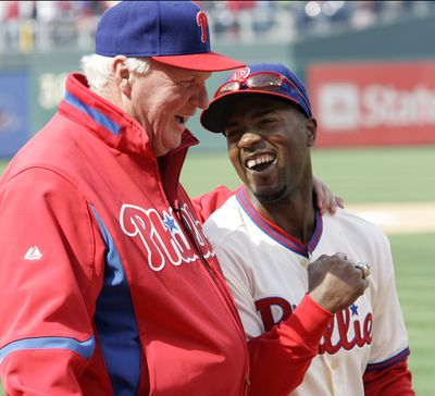 Skipper Charlie Manuel and  Jimmy Rollins flash rings.  (Associated Press / The Spokesman-Review)