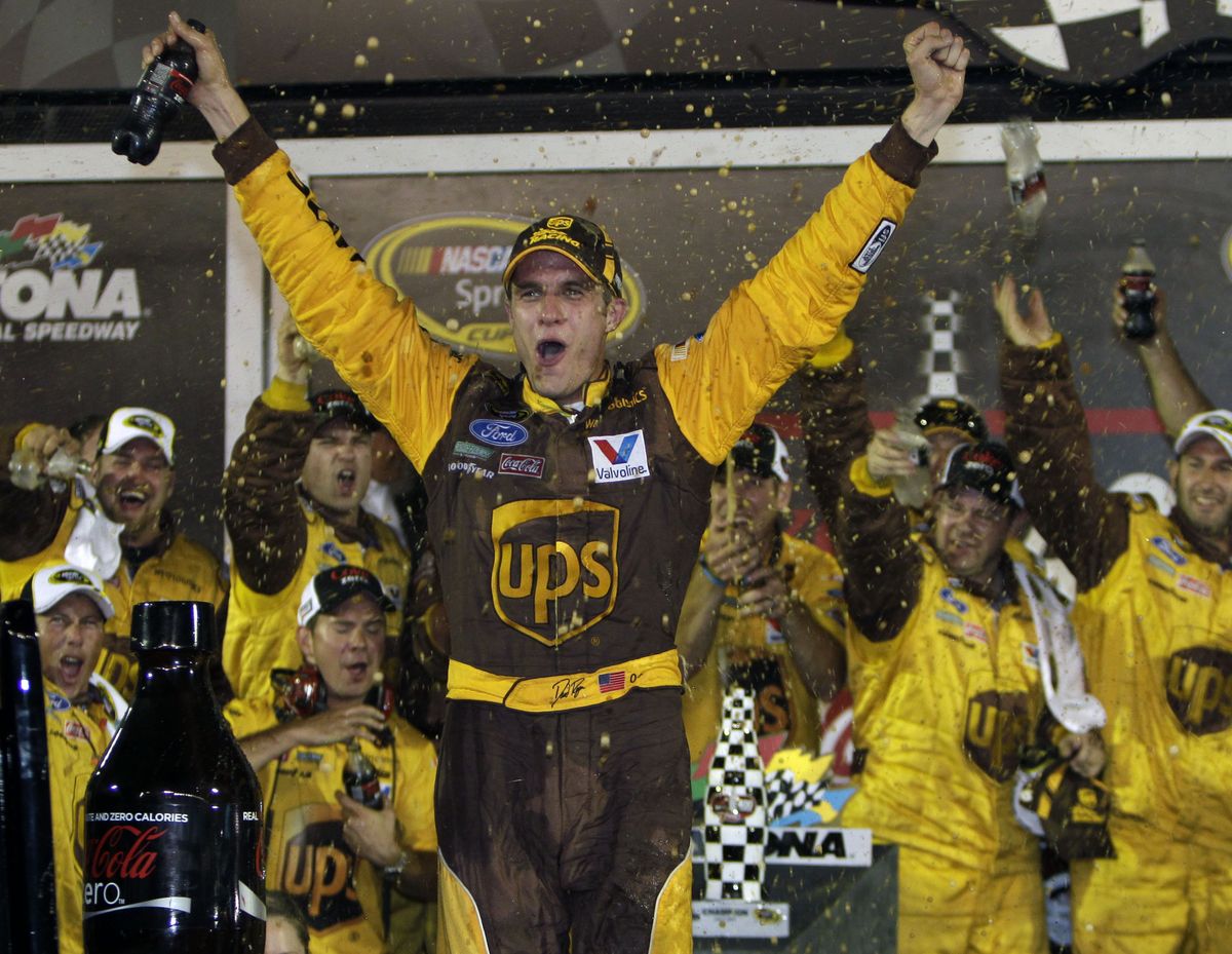 David Ragan celebrates after winning the NASCAR Coke Zero 400 auto race at Daytona International Speedway on Saturday. (Associated Press)