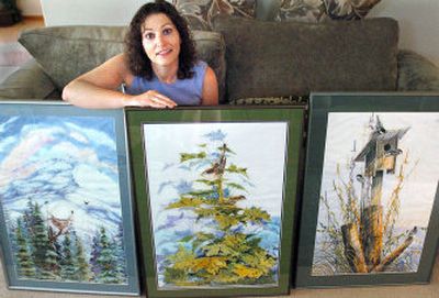 
Angela Ross displays three paintings by Canadian artists Elaine and Andy Alfoldy.  Ross, who has been collecting watercolors by these artists for about six years, has 15 originals throughout her Spokane home. 
 (Joe Barrentine / The Spokesman-Review)